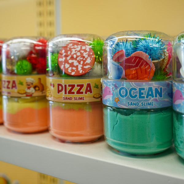 Pots de sable à modeler Pizza et Ocean sur une tablette